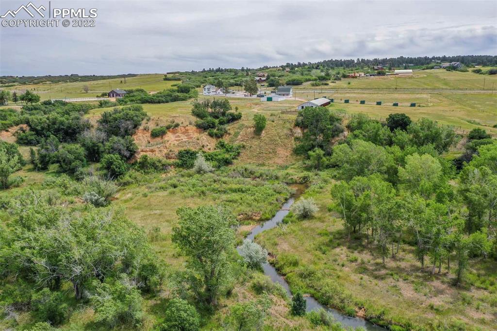 2073 North Perry Park Road Sedalia, CO 80135 - Photo 26 of 40 a view of a city with lush green forest