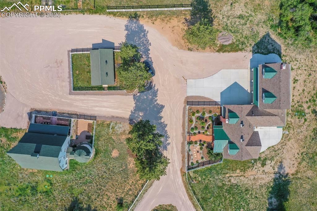 2073 North Perry Park Road Sedalia, CO 80135 - Photo 30 of 40 an aerial view of a house with garden space and street view