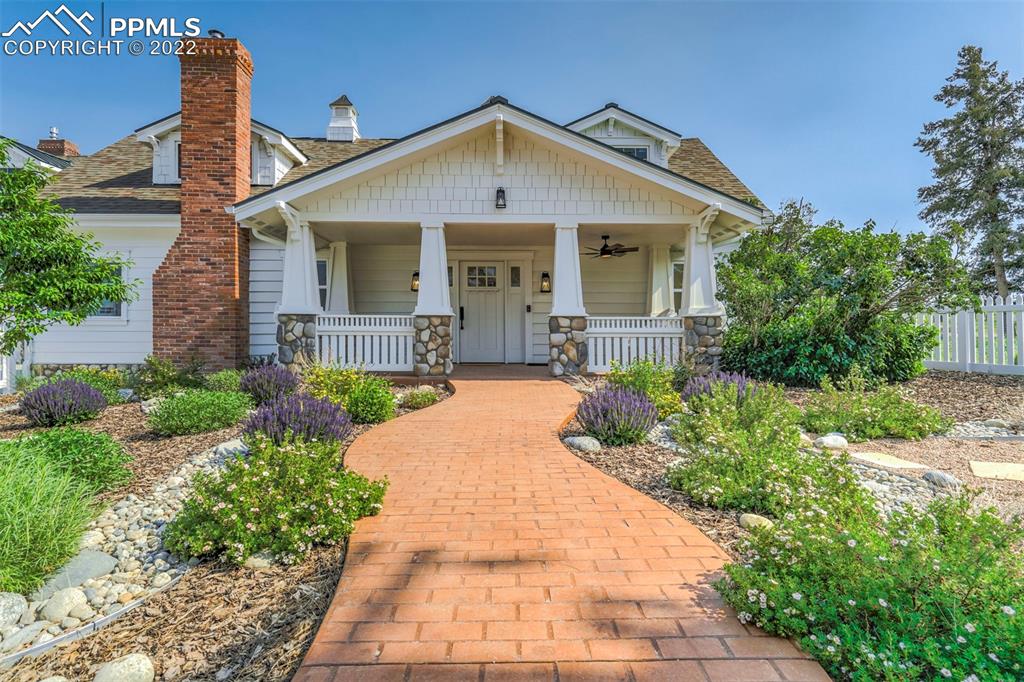 2073 North Perry Park Road Sedalia, CO 80135 - Photo 40 of 40 a front view of a house with a yard
