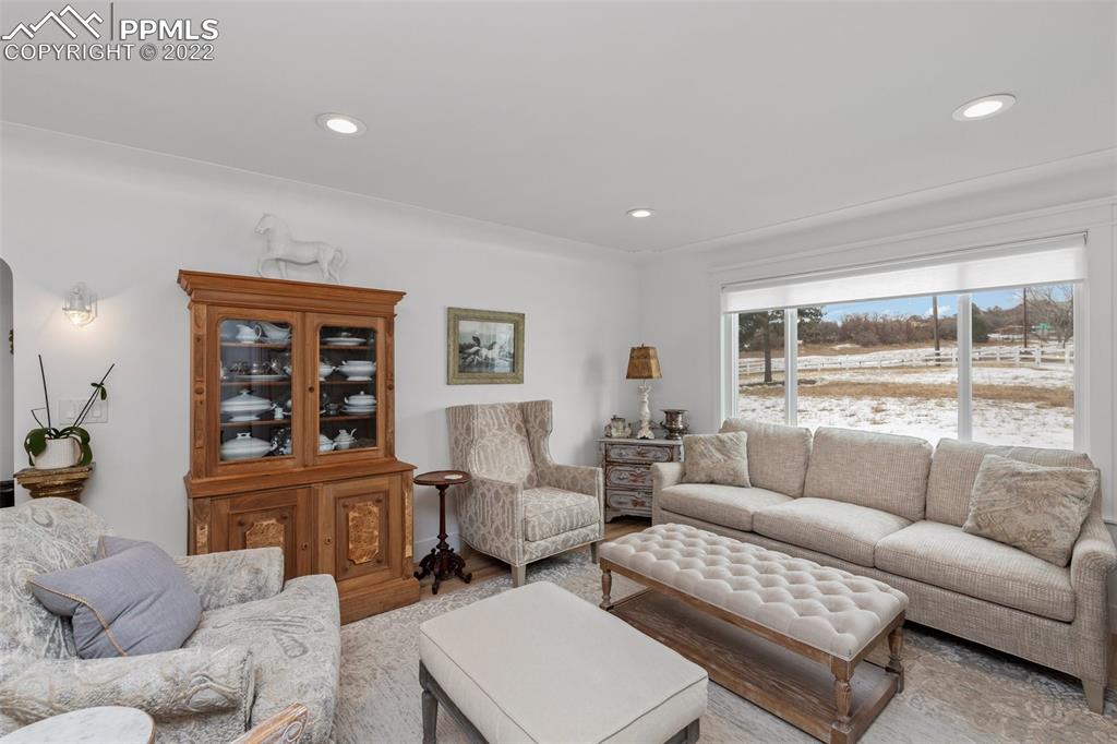 2073 North Perry Park Road Sedalia, CO 80135 - Photo 9 of 40 a living room with furniture and a large window