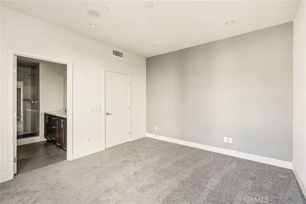 an empty room with a bathroom