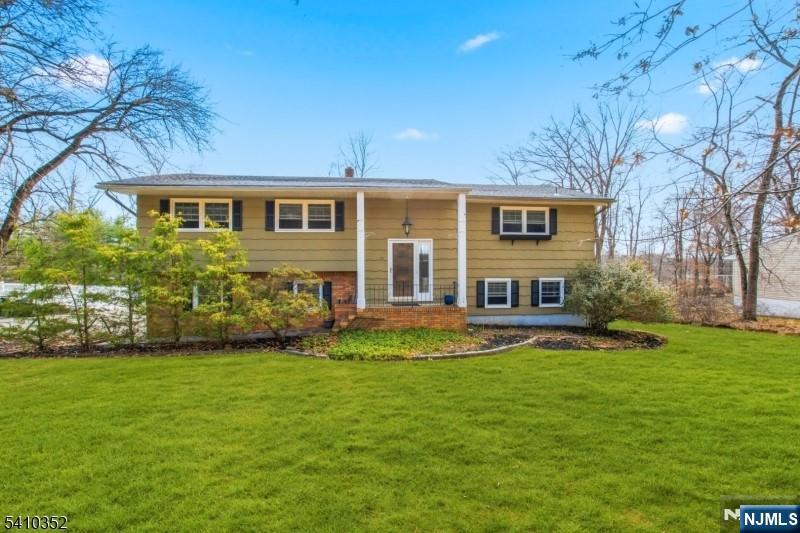 31 Blue Ridge Avenue Green Brook, NJ 08812 - Photo 1 of 1 a front view of a house with a garden