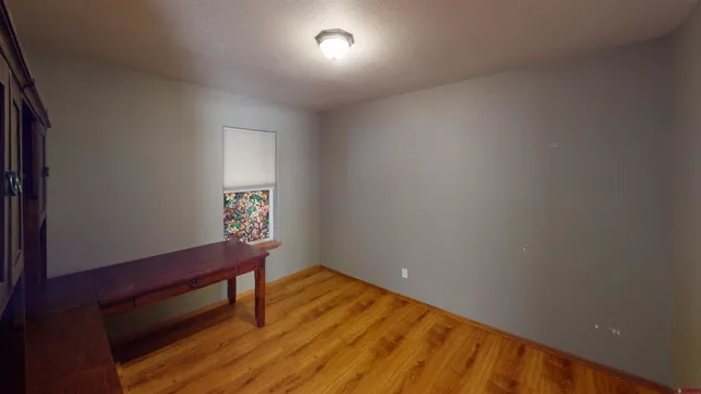 a room with furniture and wooden floors