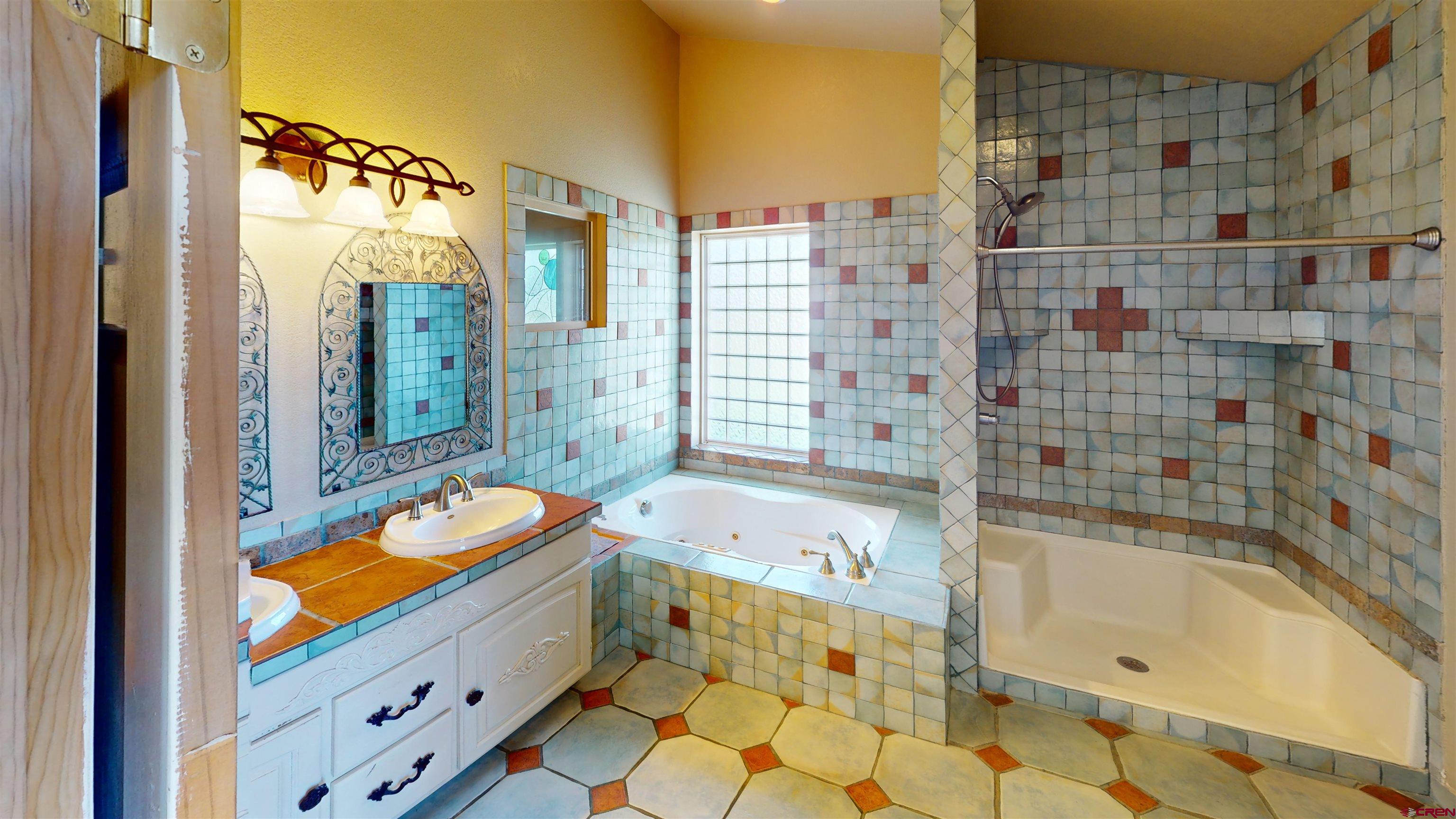 309 Main Street Romeo, CO 81148 - Photo 34 of 44 a bathroom with a bathtub and a shower