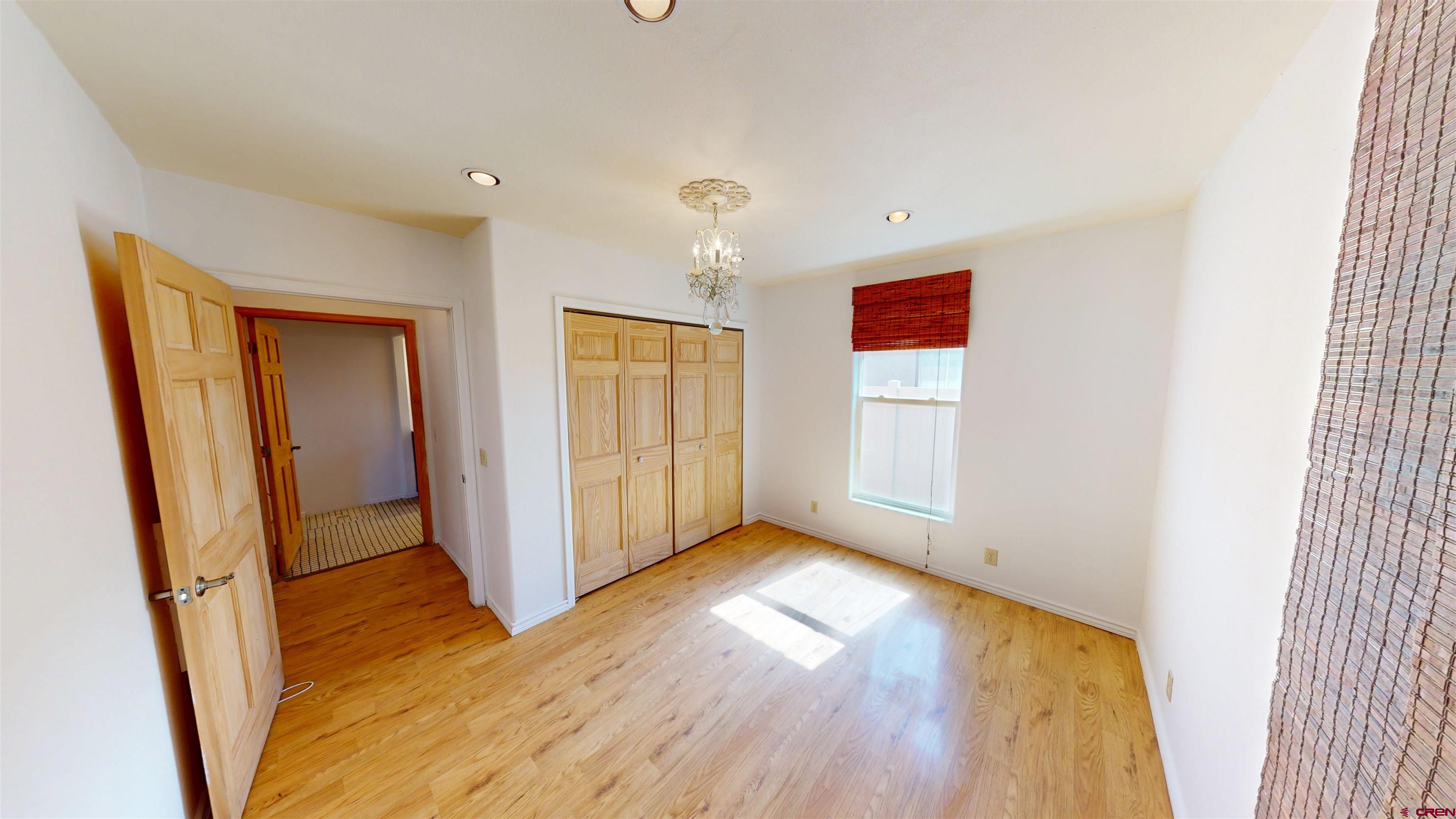 309 Main Street Romeo, CO 81148 - Photo 9 of 44 a view of entryway with wooden floor