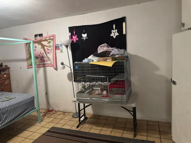 a living room with furniture and musical instruments