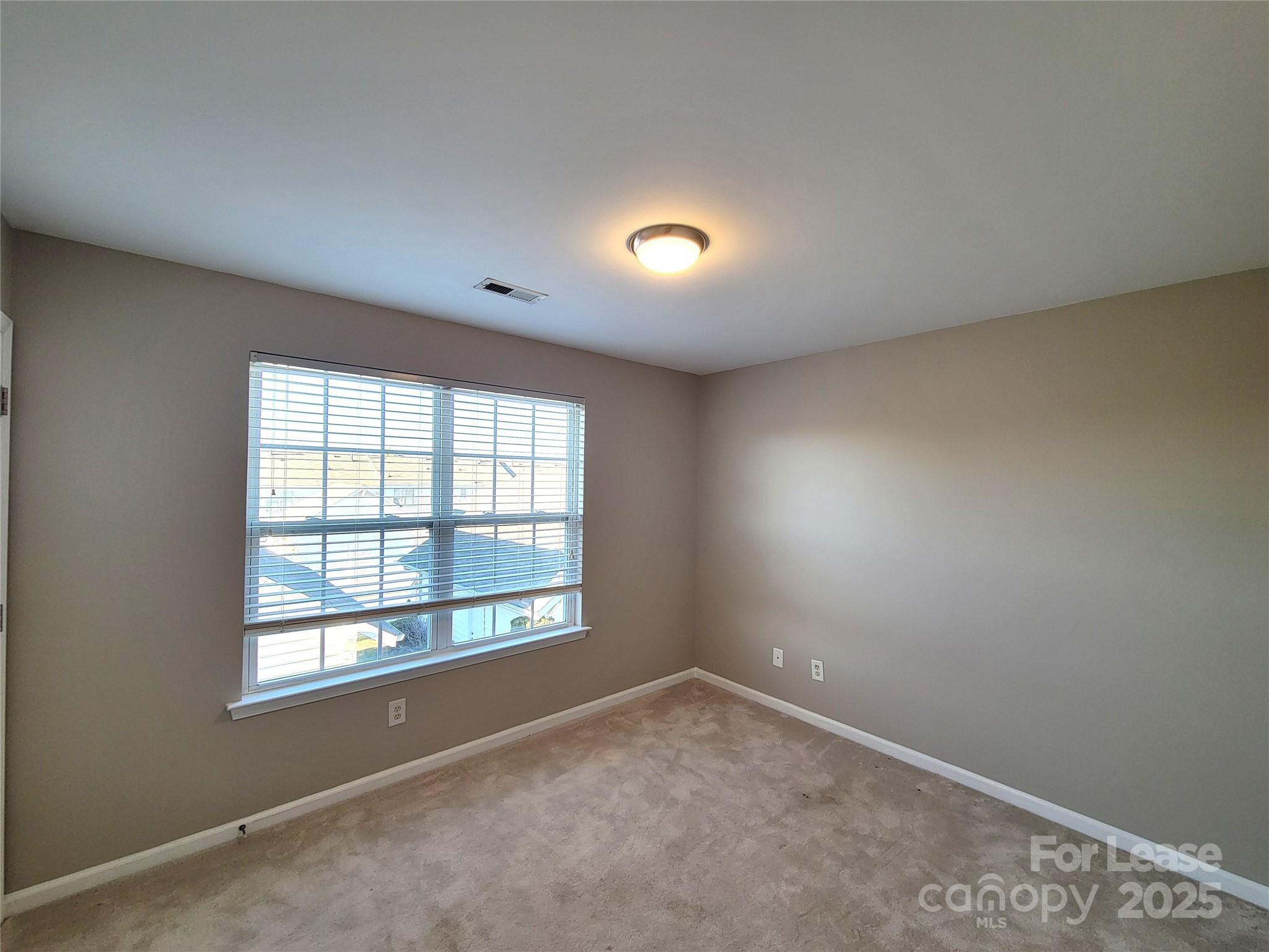 1036 Tabard Lane Matthews, NC 28104 - Photo 8 of 13 an empty room with a window