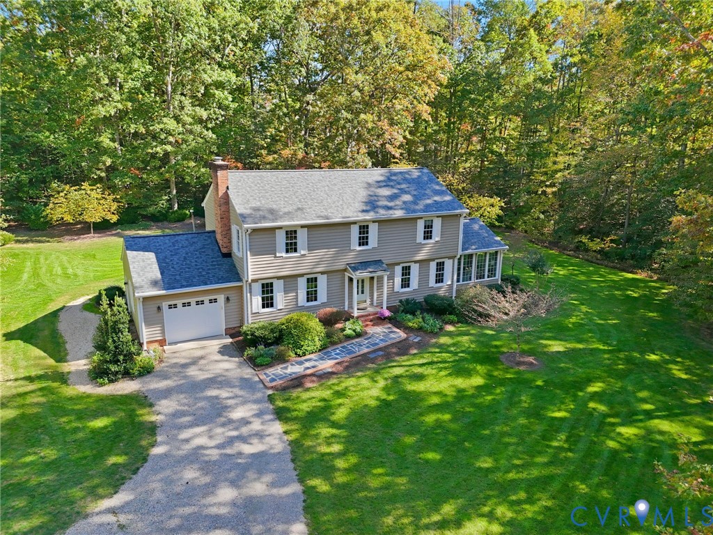 1530 Greenberry Road Powhatan, VA 23139 - Photo 1 of 49 a aerial view of a house next to a big yard and large trees