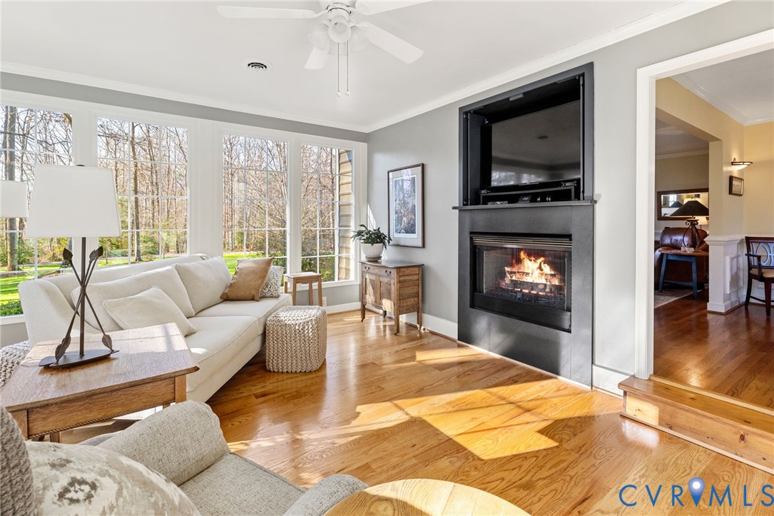 1530 Greenberry Road Powhatan, VA 23139 - Photo 14 of 49 a living room with furniture and a flat screen tv with wooden floor