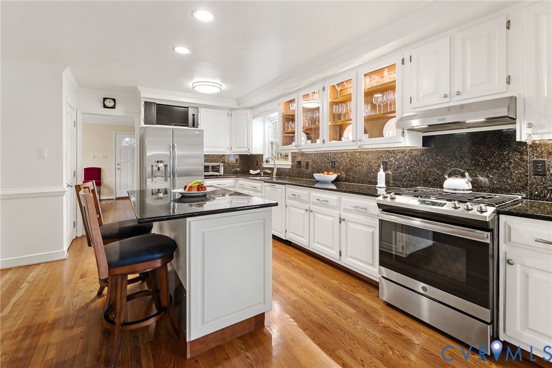 1530 Greenberry Road Powhatan, VA 23139 - Photo 18 of 49 a kitchen with a sink stove and cabinets