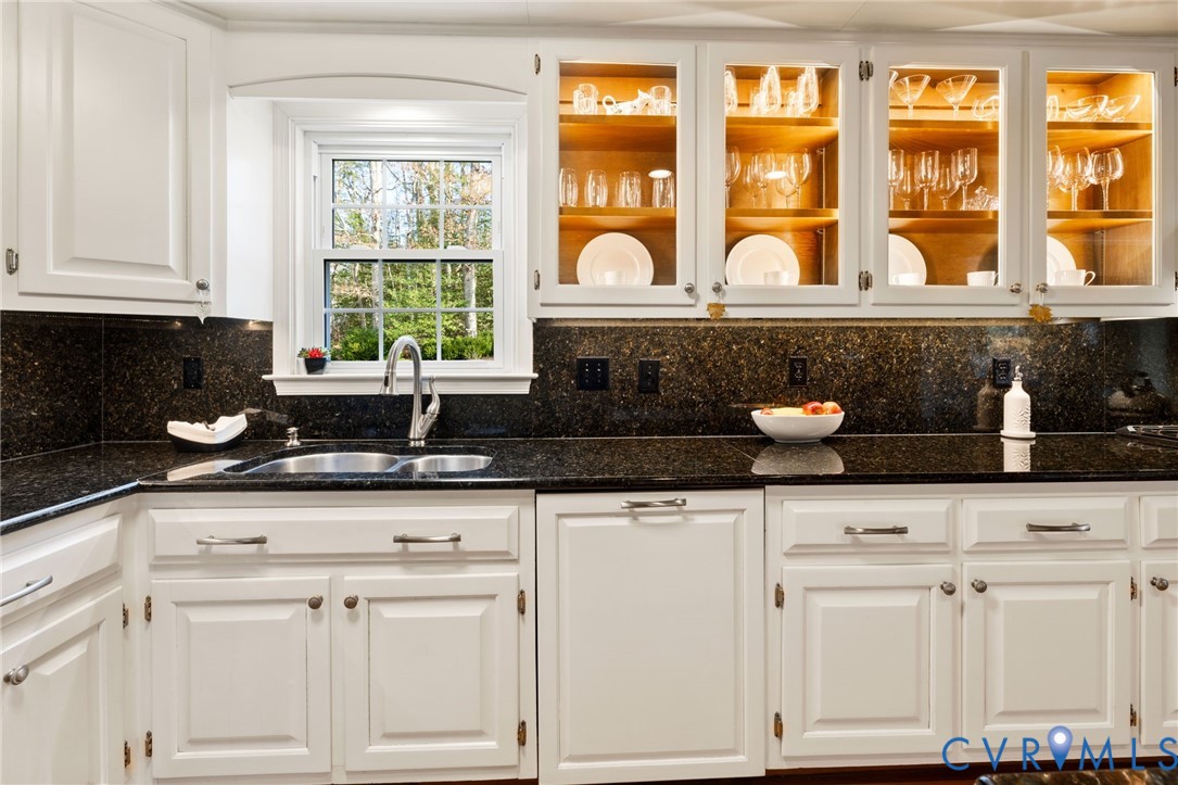 1530 Greenberry Road Powhatan, VA 23139 - Photo 20 of 49 a kitchen with white cabinets and a window