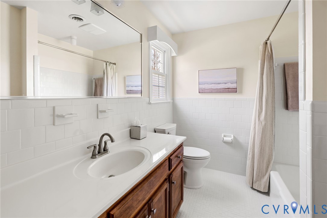 1530 Greenberry Road Powhatan, VA 23139 - Photo 27 of 49 a bathroom with a sink a toilet a mirror and shower