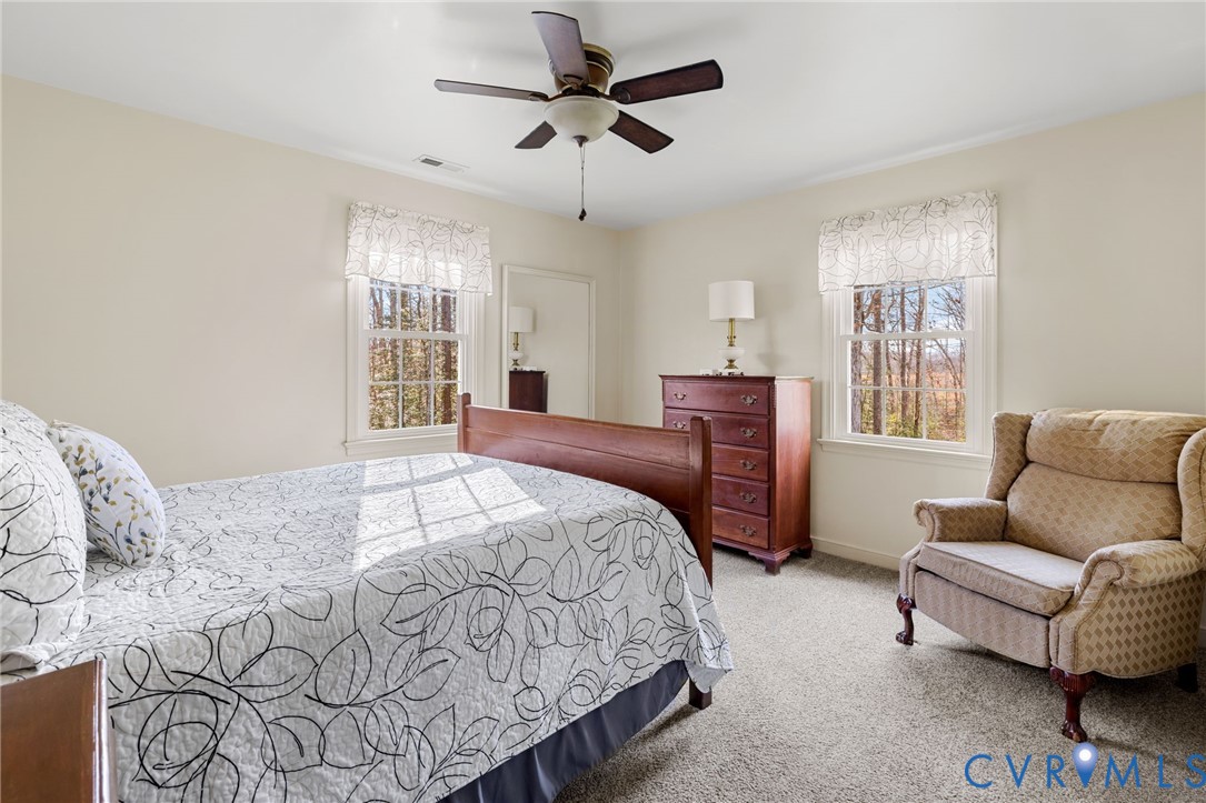 1530 Greenberry Road Powhatan, VA 23139 - Photo 31 of 49 a bedroom with a bed couch and window