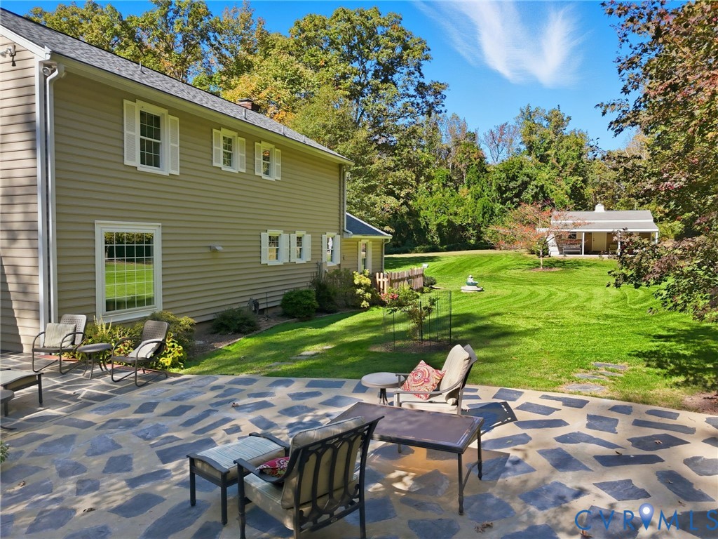 1530 Greenberry Road Powhatan, VA 23139 - Photo 32 of 49 a view of a chair and table in backyard of the house