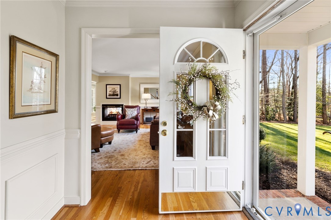 1530 Greenberry Road Powhatan, VA 23139 - Photo 8 of 49 a living room with furniture and a flat screen tv