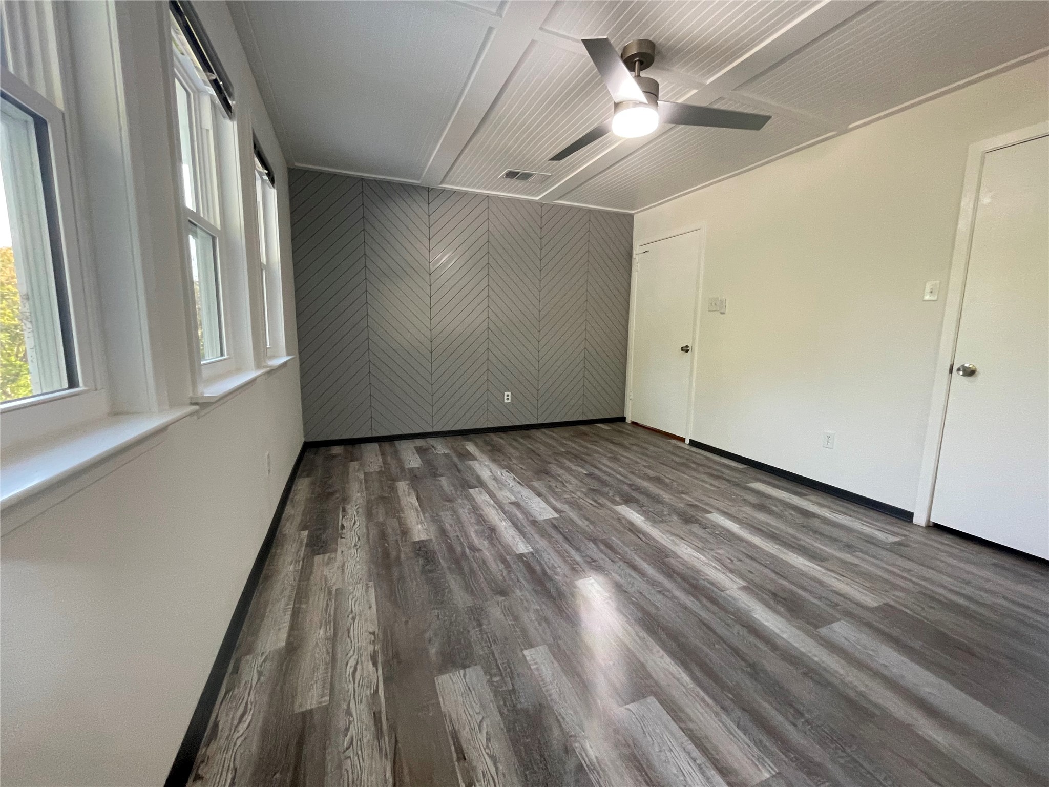 5802 Longhorn Landing Austin, TX 78734 - Photo 19 of 38 Unfurnished bedroom with dark wood-type flooring and a ceiling fan