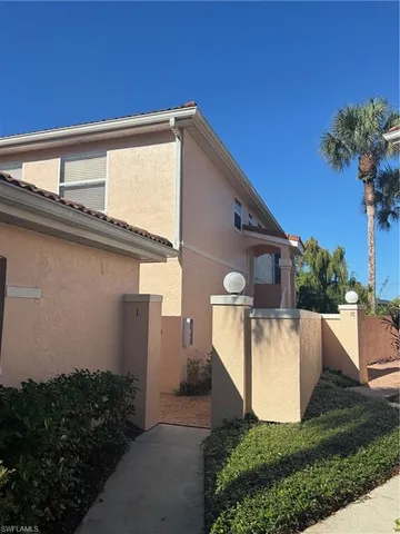 a view of a house with pool and garden
