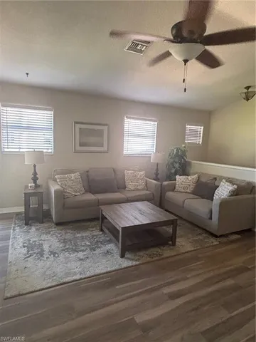 a living room with furniture and a couch