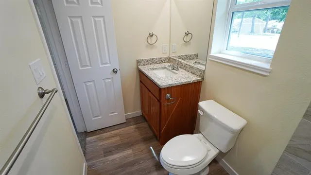 a bathroom with a sink a toilet and bathtub
