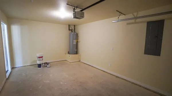 a front view of a house with a yard table and chairs
