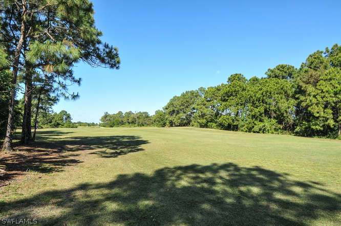 4688 Fairloop Lehigh Acres, FL 33973 - Photo 24 of 24 a view of an ocean and a yard