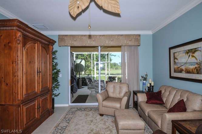 4688 Fairloop Lehigh Acres, FL 33973 - Photo 9 of 24 a living room with furniture and a window