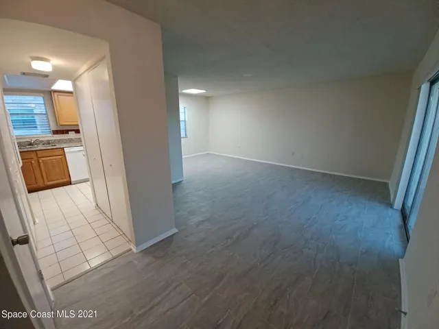 a view of a kitchen from the hallway