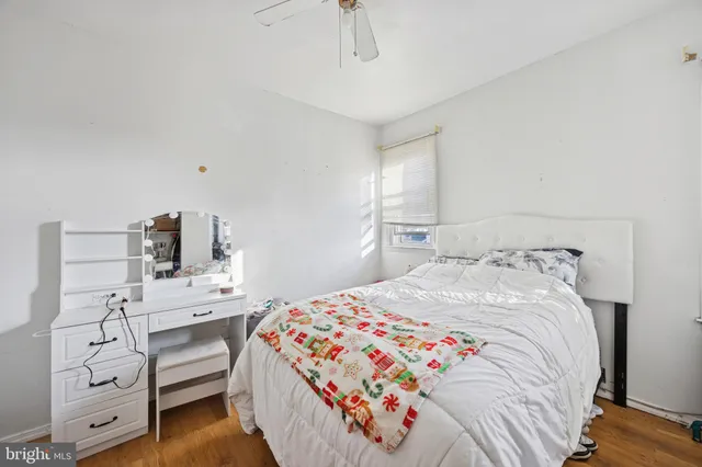 a bedroom with a bed and a desk