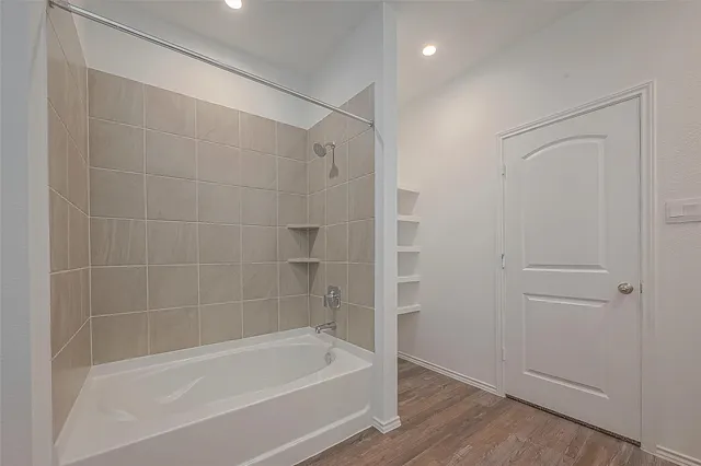 a close view of a bathtub in bathroom