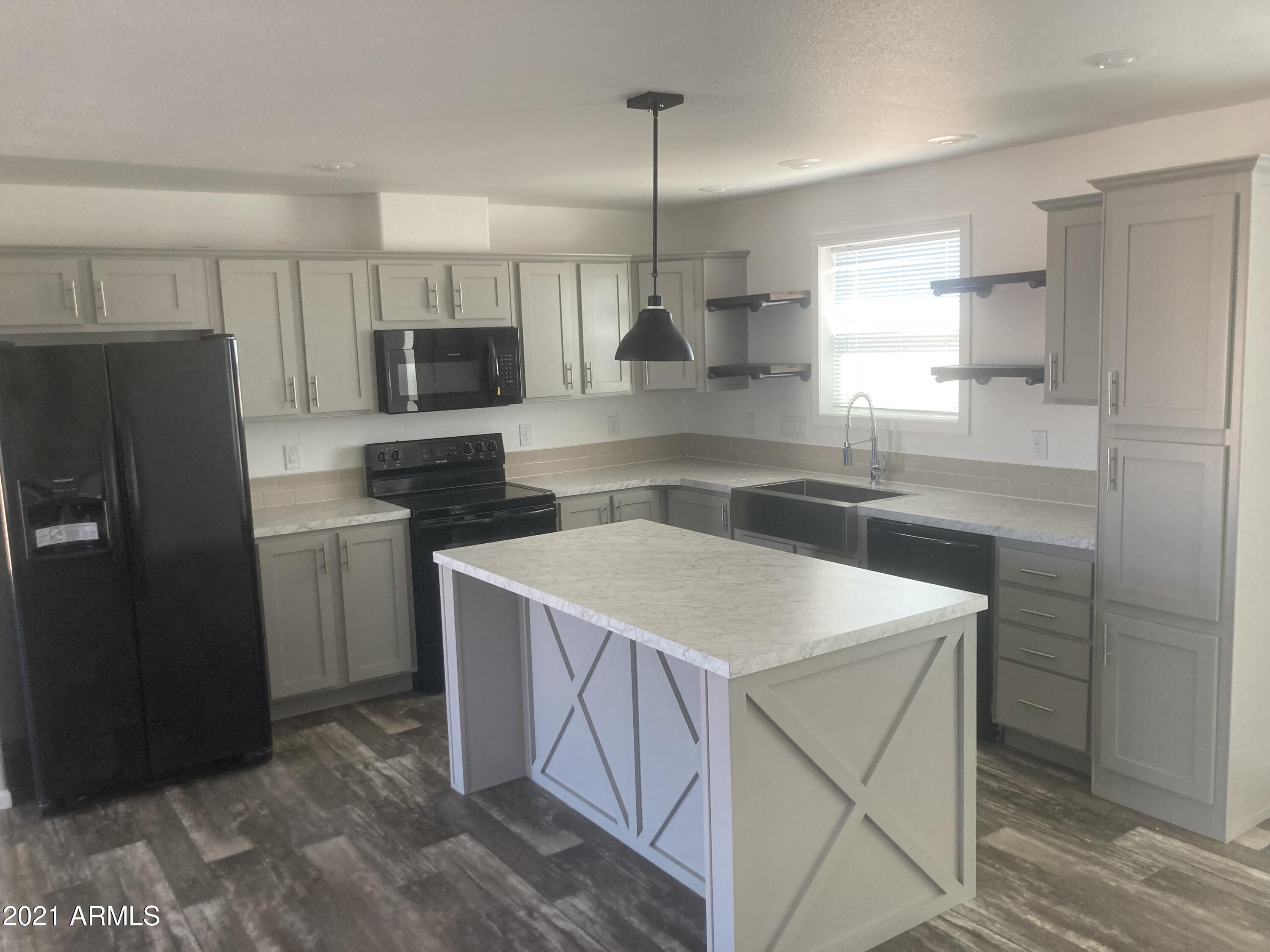 21223 West Sleepy Ranch Road Wittmann, AZ 85361 - Photo 6 of 15 Kitchen view 2