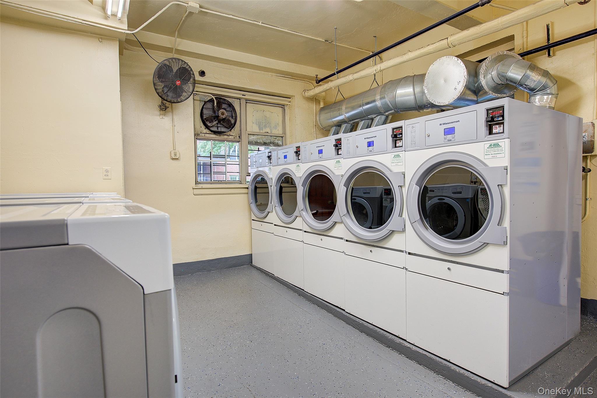 77-14 113th Street, Unit 4S Queens, NY 11375 - Photo 28 of 40 a utility room with dryer and washer