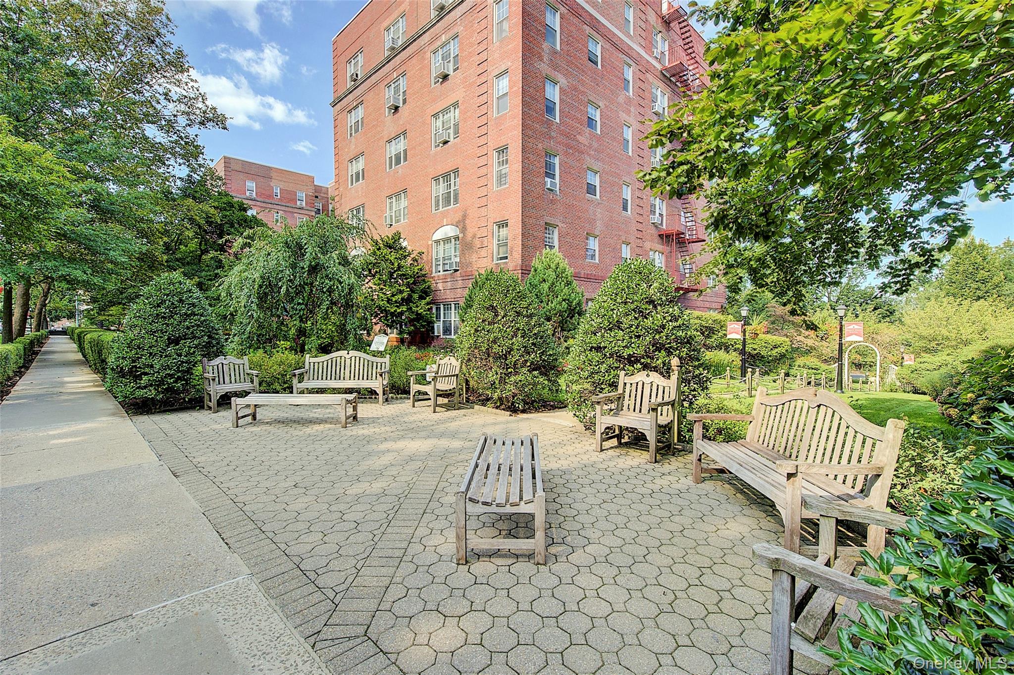 77-14 113th Street, Unit 4S Queens, NY 11375 - Photo 35 of 40 a view of a patio with a table and chairs and potted plants