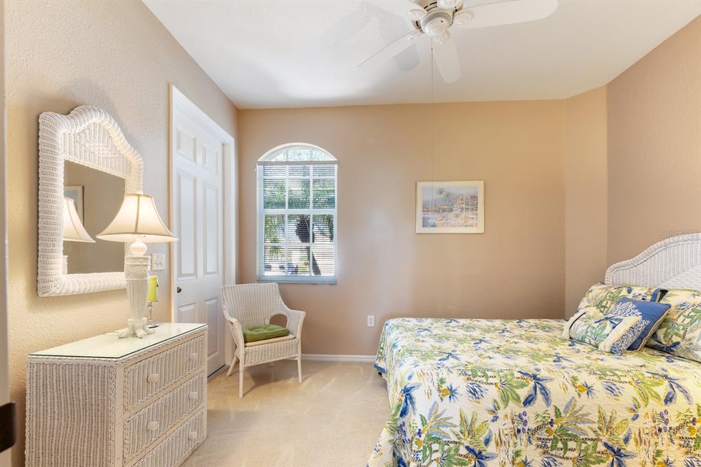 3181 Matecumbe Key Road, Unit 28 Punta Gorda, FL 33955 - Photo 13 of 39 a bedroom with a bed and a window