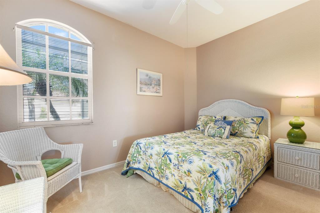 3181 Matecumbe Key Road, Unit 28 Punta Gorda, FL 33955 - Photo 14 of 39 a bedroom with a bed and window