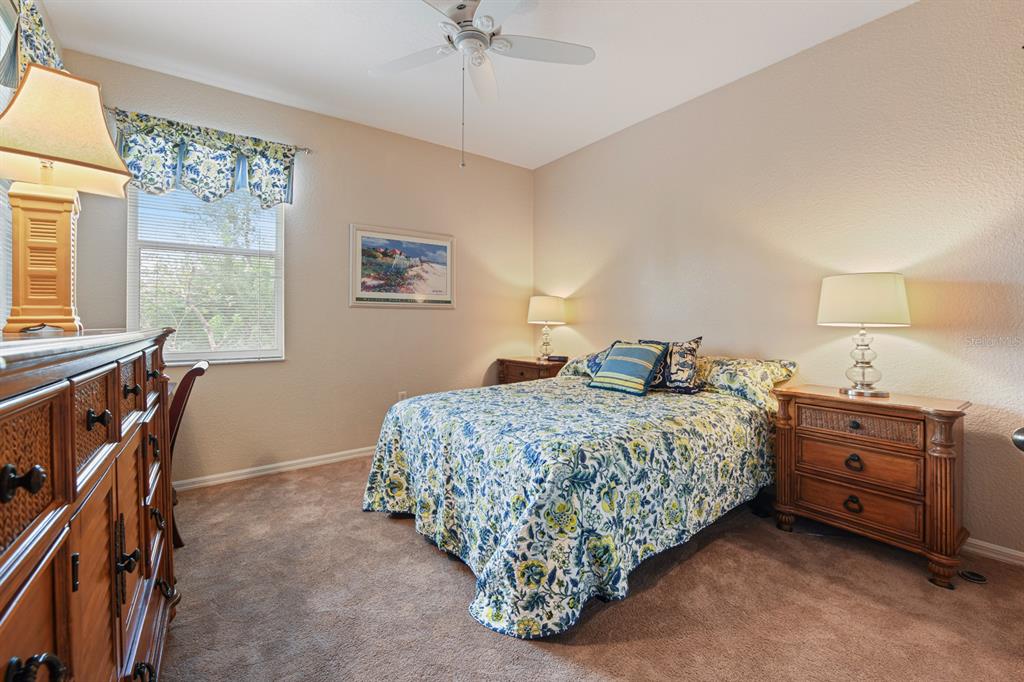 3181 Matecumbe Key Road, Unit 28 Punta Gorda, FL 33955 - Photo 21 of 39 a bedroom with a bed and a table
