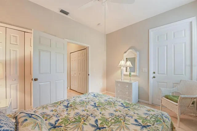 a bedroom with a bed and a cabinets