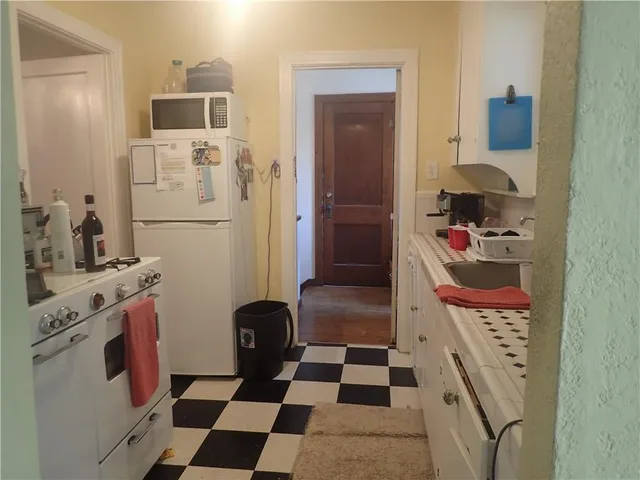 a bathroom with a sink and a washing machine