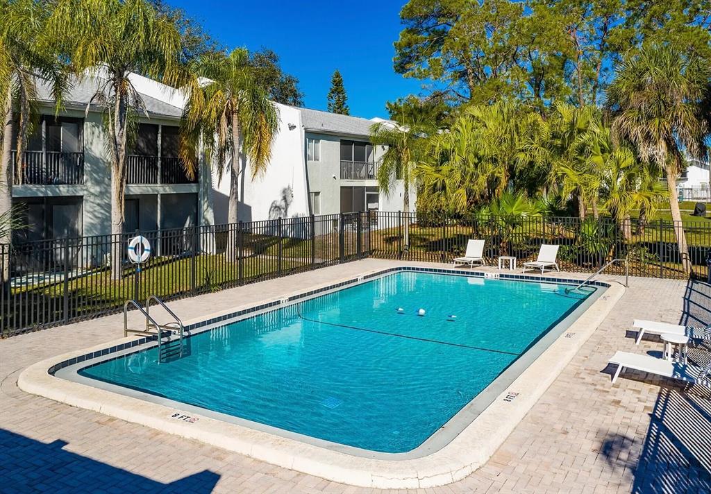 13300 Walsingham Road, Unit 6 Largo, FL 33774 - Photo 12 of 21 a view of a swimming pool with a patio