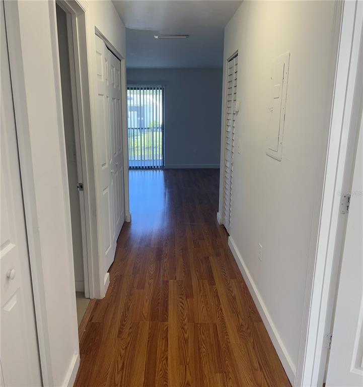 13300 Walsingham Road, Unit 6 Largo, FL 33774 - Photo 9 of 21 a view of a hallway with wooden floor