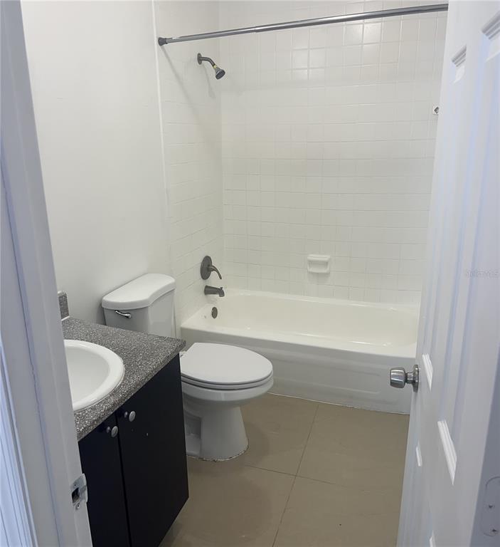 13300 Walsingham Road, Unit 6 Largo, FL 33774 - Photo 10 of 21 a bathroom with a sink a toilet and shower