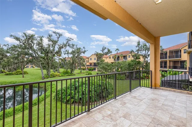 a balcony with trees in front of it