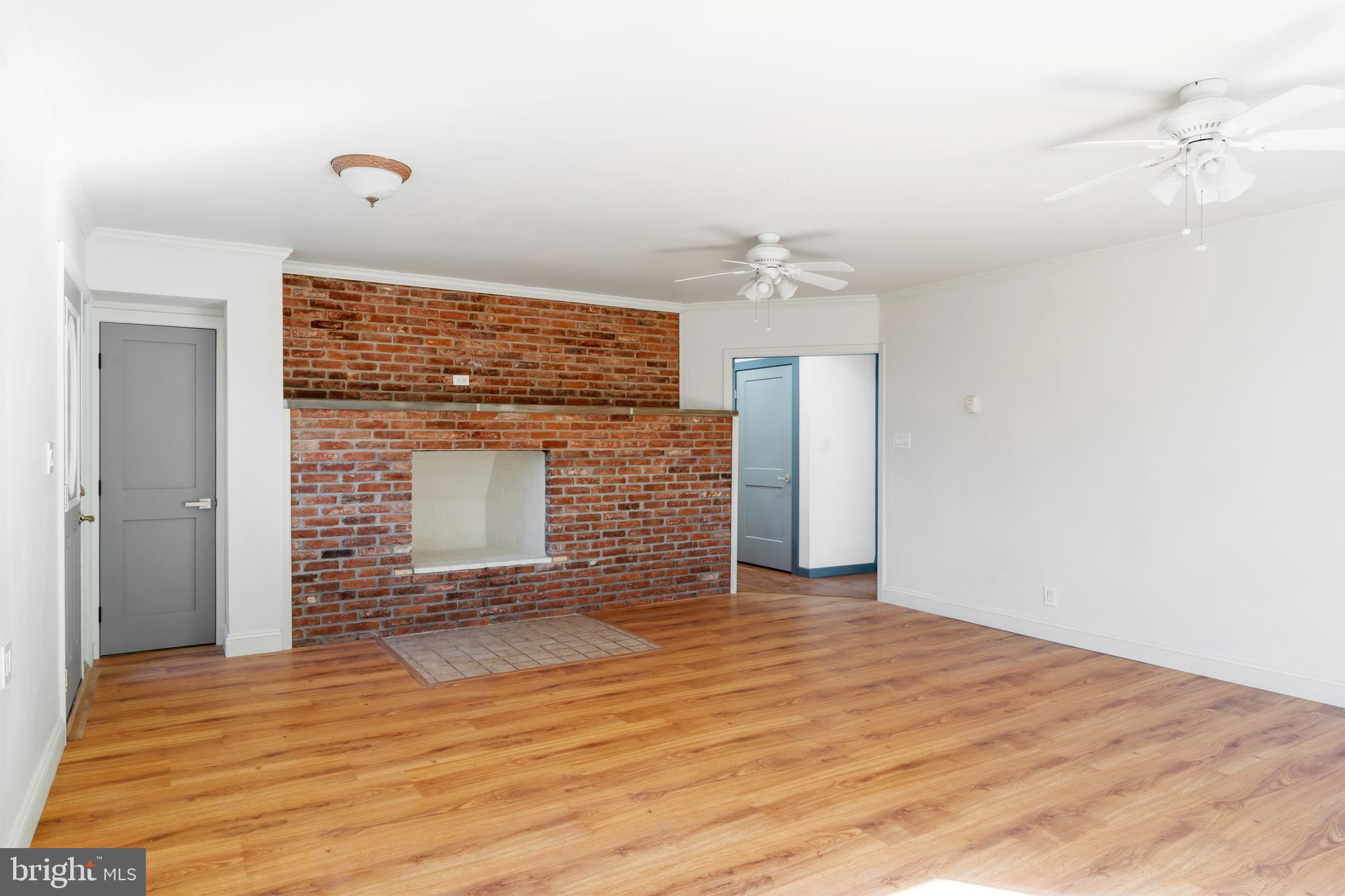 3211 Pricetown Road Fleetwood, PA 19522 - Photo 14 of 71 a view of a livingroom with wooden floor and a fireplace