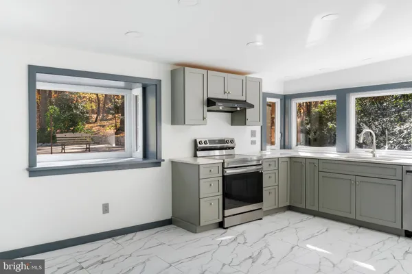 a view of cabinets with wooden floor
