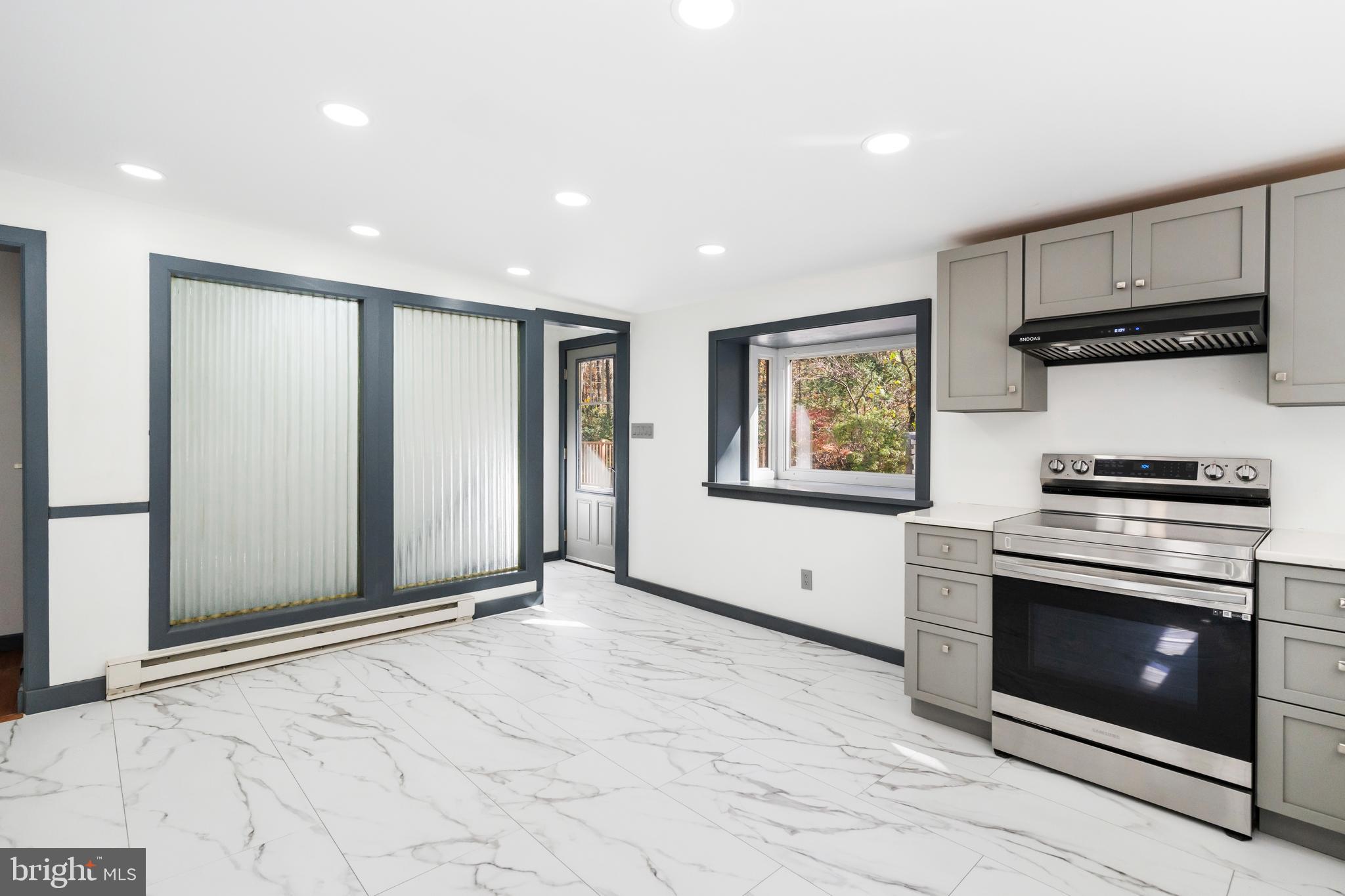 3211 Pricetown Road Fleetwood, PA 19522 - Photo 24 of 71 a view of kitchen with stainless steel appliances granite countertop a stove a microwave and a refrigerator