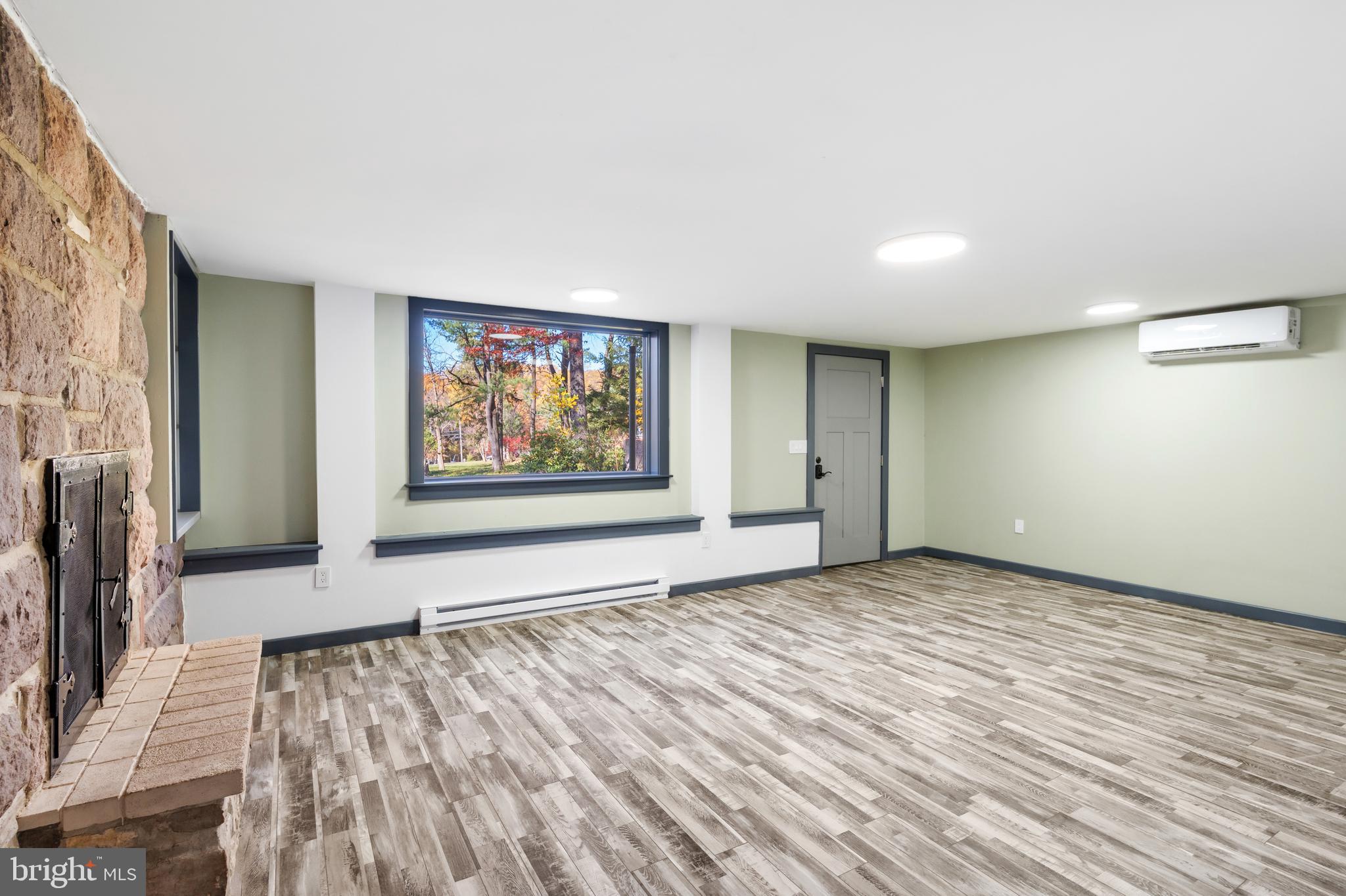 3211 Pricetown Road Fleetwood, PA 19522 - Photo 27 of 71 a view of an empty room with wooden floor and a window