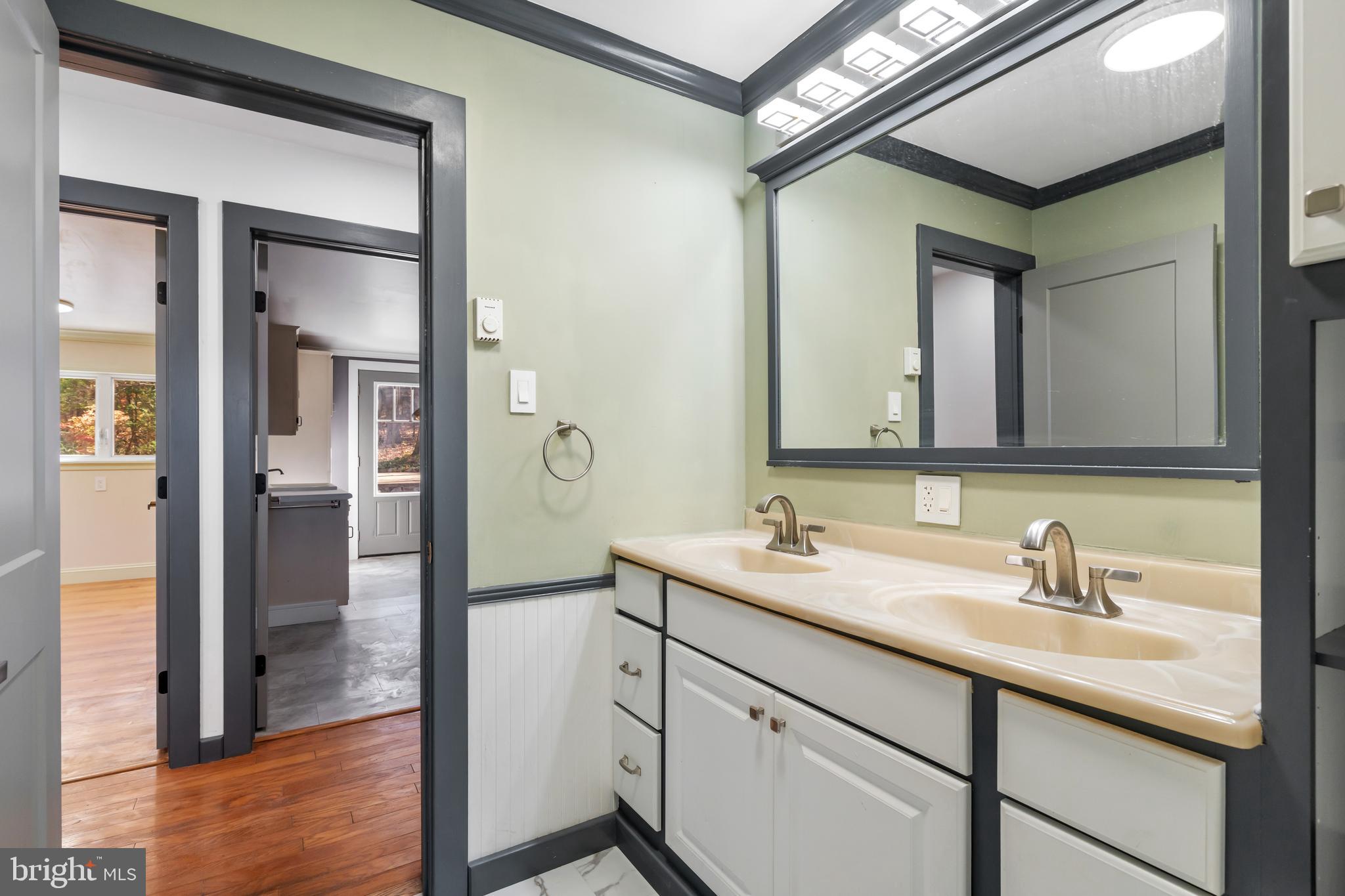 3211 Pricetown Road Fleetwood, PA 19522 - Photo 30 of 71 a bathroom with a sink and a mirror