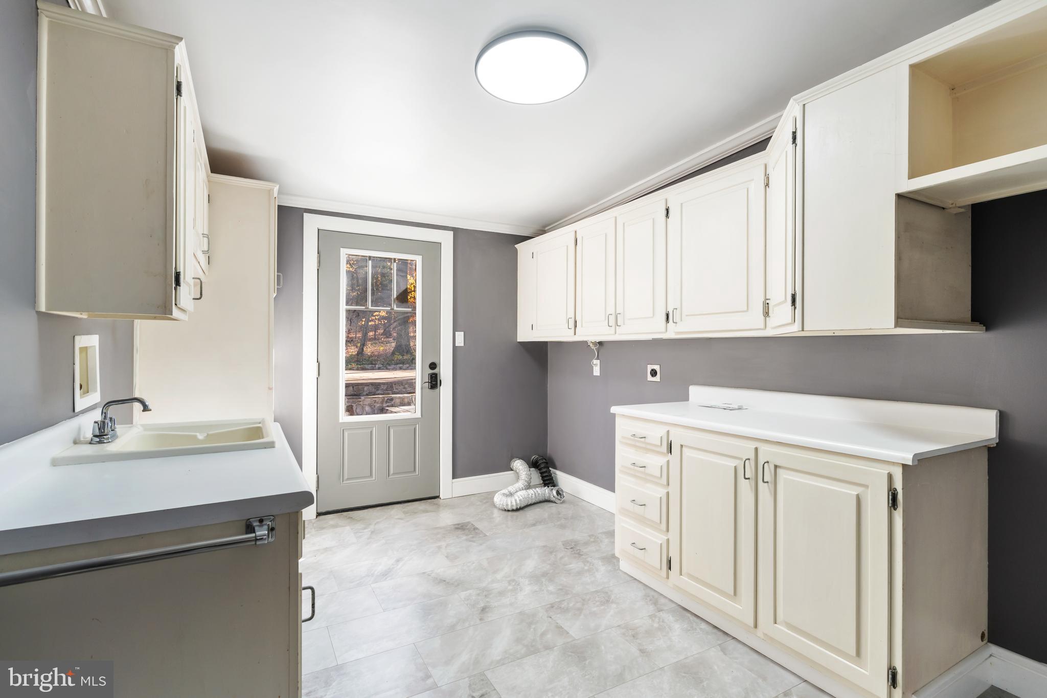 3211 Pricetown Road Fleetwood, PA 19522 - Photo 46 of 71 a kitchen with a sink stove and cabinets