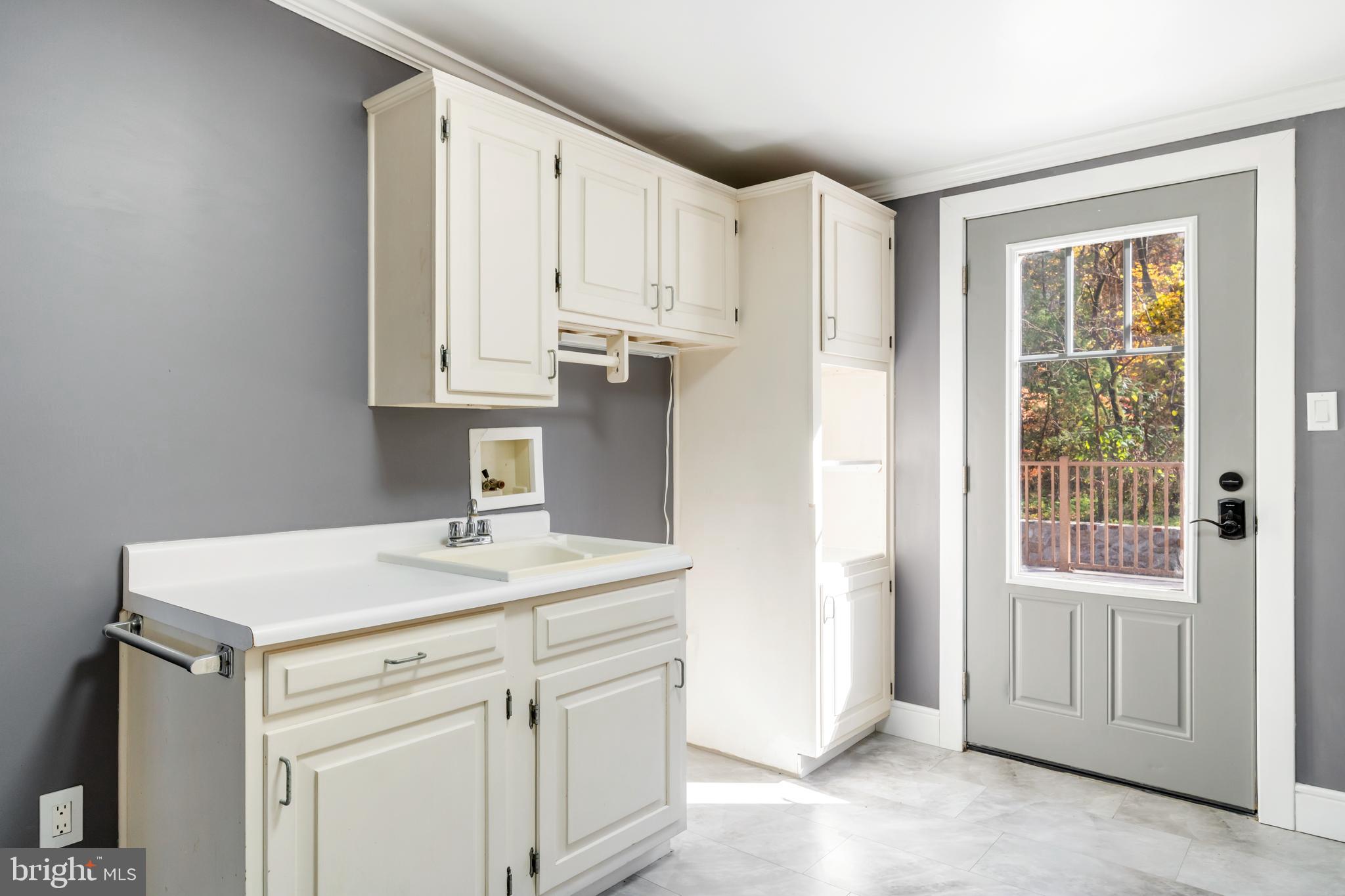 3211 Pricetown Road Fleetwood, PA 19522 - Photo 47 of 71 a kitchen with a sink dishwasher and white cabinets
