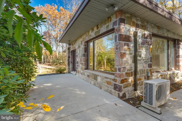 an aerial view of residential houses with outdoor space and swimming pool