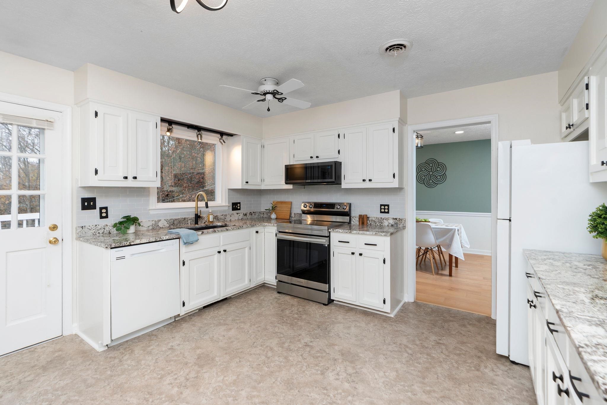 1222 Pinehurst Road Staunton, VA 24401 - Photo 11 of 52 a kitchen with white cabinets and white appliances